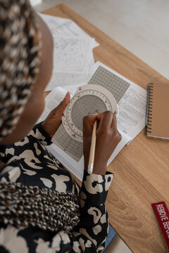Woman using slide rule device