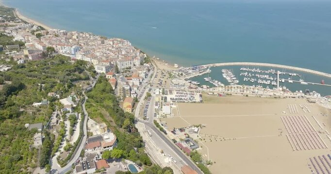 Aerial view of Levante beach and the marina of Rodi Garganico. It is a tourist destination in Gargano, in the province of Foggia, Puglia, Italy. The town overlooks the Adriatic Sea.
