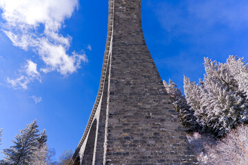 Scenic view of railway viaduct named Schmittentobel at Albula Valley with blue sky background in...