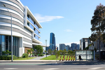 Modern architecture alongside urban greenery in a vibrant cityscape