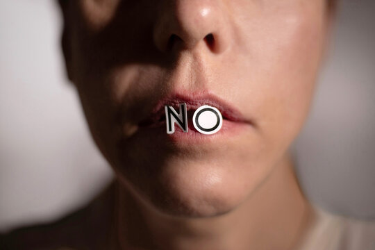 Close-up of Lips with the Word No Emphasizing Rejection