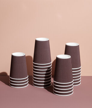Stack of coffee cups on muted background