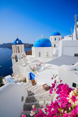 traditional greek stairs in village Oia of Santorini, with stairs and blue dome, Greece © neirfy