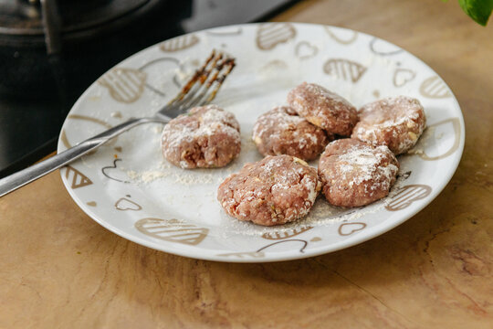 Typical albanian uncooked meatballs qofte on the table