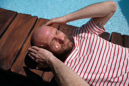 Man Relaxing by Pool