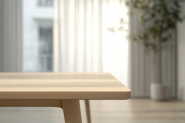 Fototapeta premium Sunlight streaming through sheer curtains illuminates a simple wooden table in a serene indoor space with minimalist decor and a hint of greenery