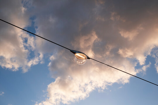 Streetlight Against Cloudy Sky