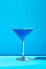 A blue lagoon cocktail on a minimalistic summer background. for menus, for bars. for a banner, for advertising.