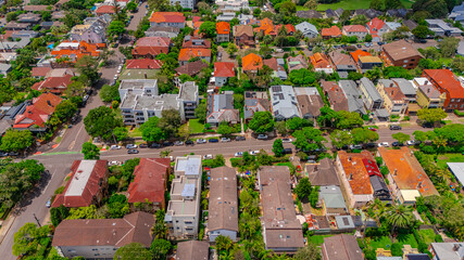 Aerial View of Manly Beach and Sydney harbour with manly houses on a warm summer day blue skies Sydney NSW Australia