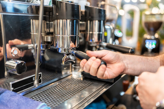 Barista preparing portafilter for making coffee