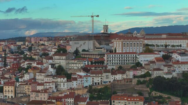 University of Coimbra. Aerial 4K drone video footage of Coimbra city old town on the hill. Panoramic cityscape, Portugal