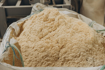 Big bag containing wood sawdust for modular building industry