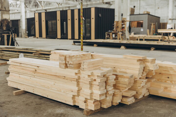 Wooden planks stacked in modular building construction factory
