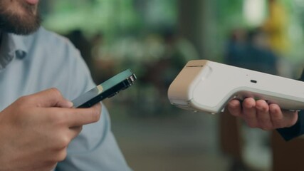 Contactless payment visitor customer business client buyer cafe man guy male businessman pay phone NFC smartphone purchase online bank credit card scan wifi technology terminal waiter serving cashless - Powered by Adobe