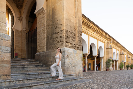Woman posing at Great Mosque of Cordoba courtyard
