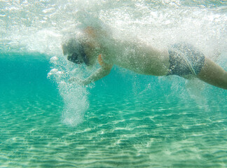 person swimming underwater