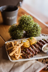 meat, fries and corn. Delicious