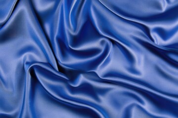 Fototapeta premium Top-Down View of Luxurious Dark Blue Silk Fabric, Showcasing Smooth Satin Texture and Elegant Background for Abstract Designs
