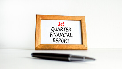 1st quarter financial report symbol. Concept words 1st quarter financial report on beautiful wooden frame. Beautiful white background. Business 1st quarter financial report concept. Copy space.