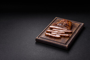 Juicy pork steak baked on the grill with salt, spices and herbs