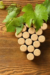 Wine corks in the shape of grapes  on a wooden table. Top view with copy space for text