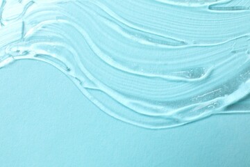 Smear of cream and gel on a colored background