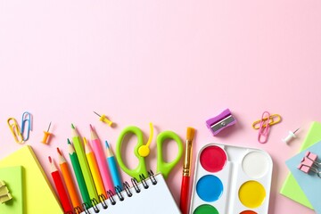 Flat lay with school stationery on color background, top view
