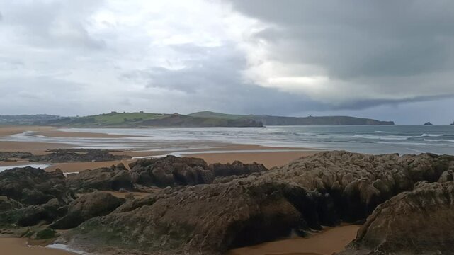 Windy and cloudy day at Liencres beach.