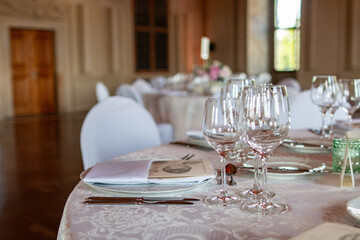 A beautifully arranged table with glassware and napkins, perfect for formal gatherings or celebrations