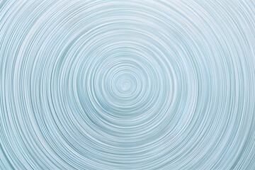 Abstract concentric circles background, light blue and white swirling pattern. Ideal for website banners, presentations, or design projects needing a calming, modern feel.
