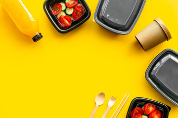 Tomatoes salad in plastic delivery tray, top view. Catering concept