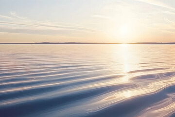 Serene sunset over calm lake water, gentle waves reflecting golden light. Perfect for tranquil, peaceful, or nature-themed designs.