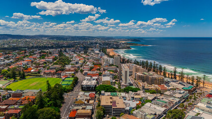 Naklejka premium Aerial View of Manly Beach and Sydney harbour with manly houses on a warm summer day blue skies Sydney NSW Australia