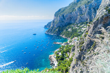 Famous Faraglioni cliffs and Capri island coast, Italy, retro toned