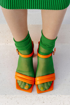 Green socks with hole and orange heels