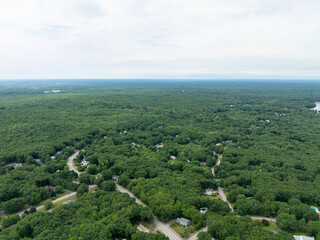 Obraz premium Aerial view of Suburban neighborhood in Sharon, Norfolk County, Massachusetts, with green forest and big villa.