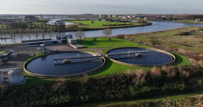Aerial drone video on waste water treatment installation. Clean purifying water in The Netherlands.
