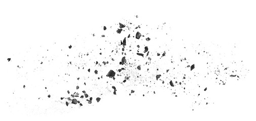 Top view of black charcoal particles on a white background. Activated charcoal powder.