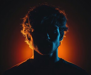 Moody side profile portrait of young man in dramatic black-and-white lighting, high-contrast studio photography, artistic male silhouette, shadows, creative expression