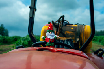 Santa Claus working on a tractor in farming. Christmas and New Year concept. 11/30/2024