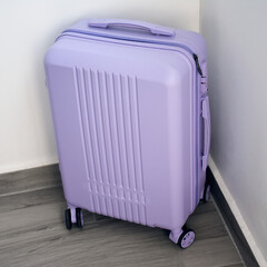 Purple luggage suitcase with wheels