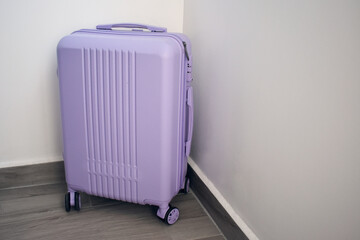 Purple luggage suitcase with wheels