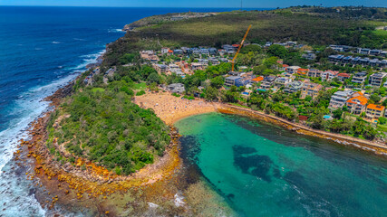 Fototapeta premium Aerial View of Manly Beach and Sydney harbour with manly houses on a warm summer day blue skies Sydney NSW Australia
