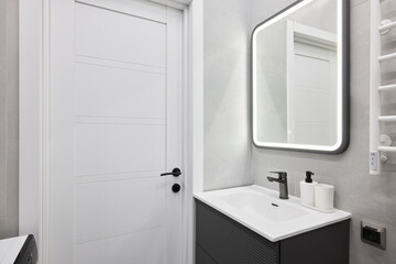 Experience a Modern Bathroom Interior that Features a Sleek Design Alongside a Mirror