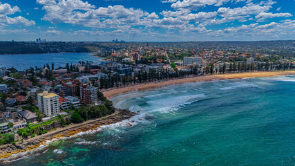 Fototapeta premium Aerial View of Manly Beach and Sydney harbour with manly houses on a warm summer day blue skies Sydney NSW Australia