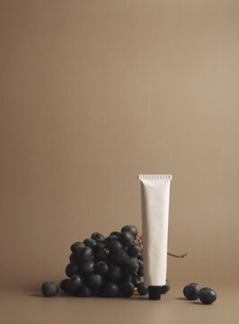 A minimalistic composition of a simple white cosmetic tube