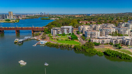 Panorama Aerial view above Rhodes with views to Meadowbank and Olympic park and Wentworth Point and Concord West with Parramatta River in Sydney NSW Australia