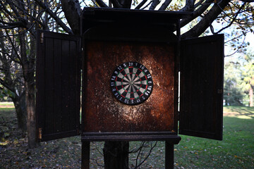 an old dartboard that has been played with a lot