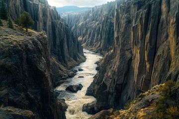 A river flowing between towering canyon walls, viewed from a high angle, capturing the grandeur of the landscape.