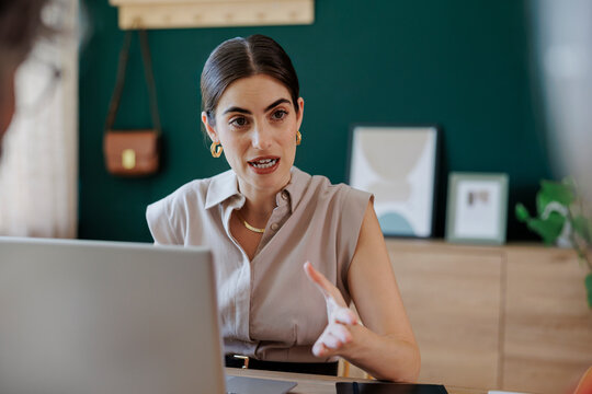 Financial advisor gesturing while explaining something during meeting